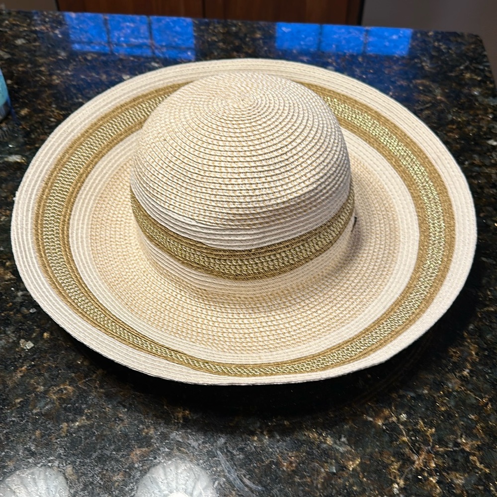 Cream and gold shimmer woven hat.15 1/2 inches brim to brim. 7 1/2 x7 in opening